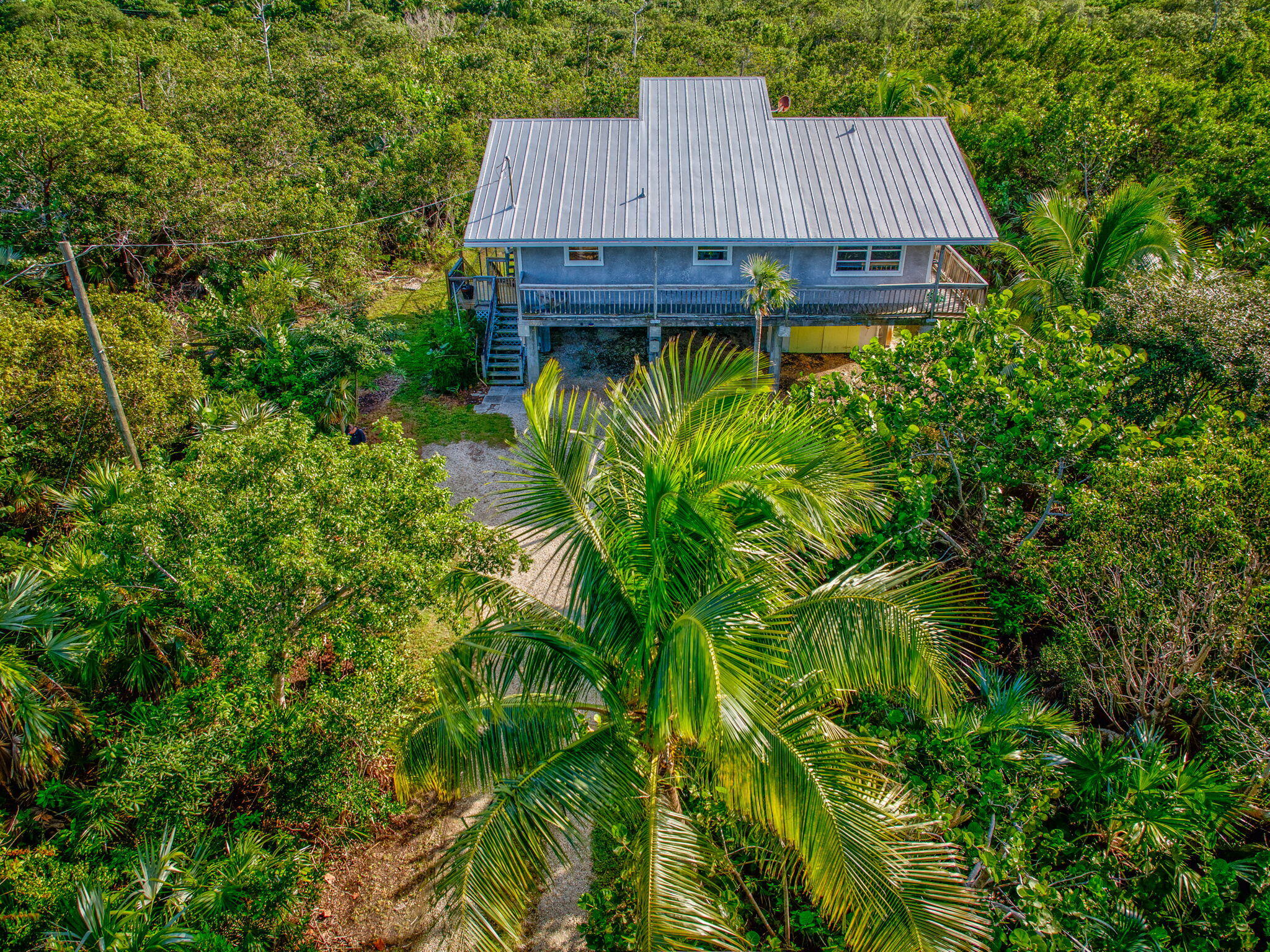 a view of a wooden deck in front of house