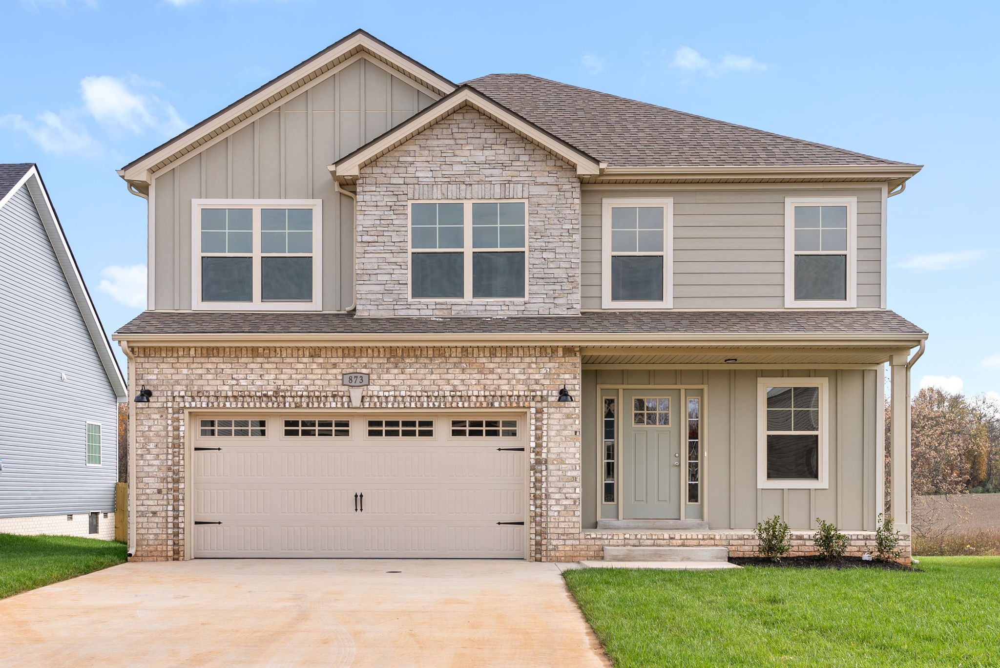 front view of a house with a yard