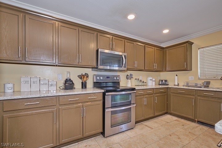 a kitchen with granite countertop cabinets stainless steel appliances and a sink