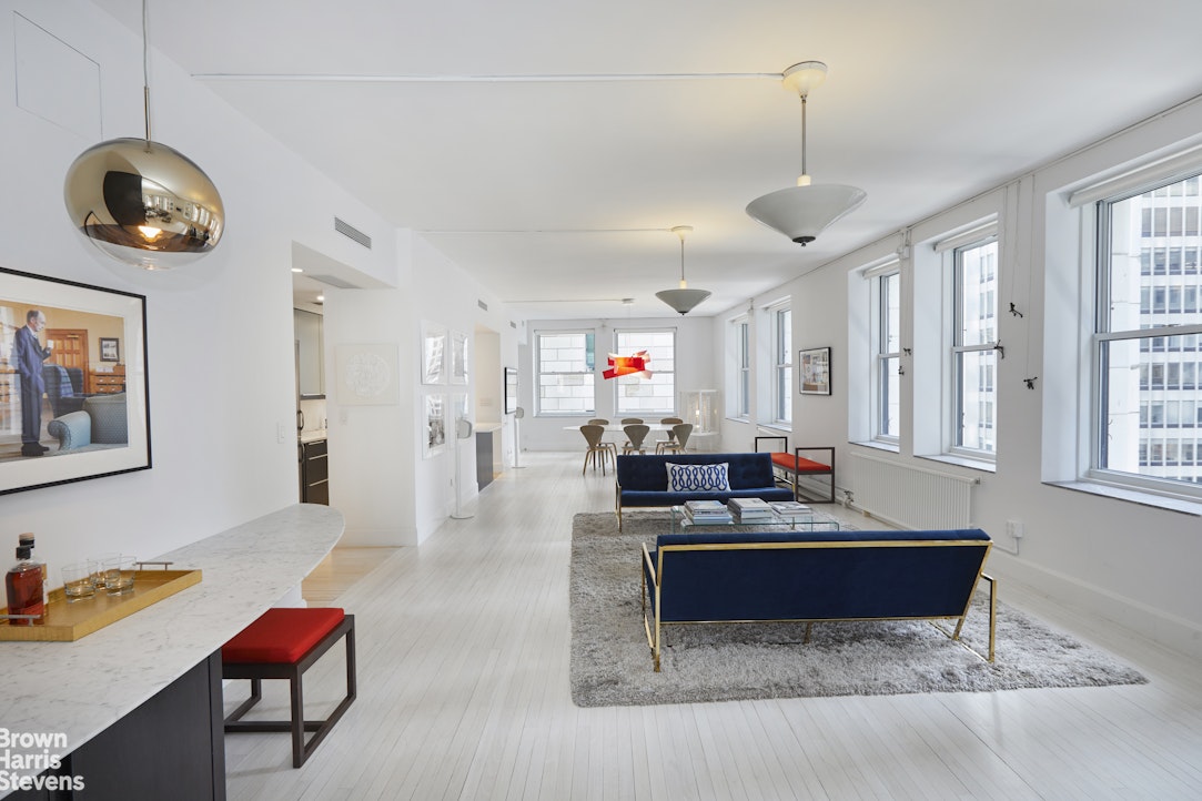 a living room with furniture and a window