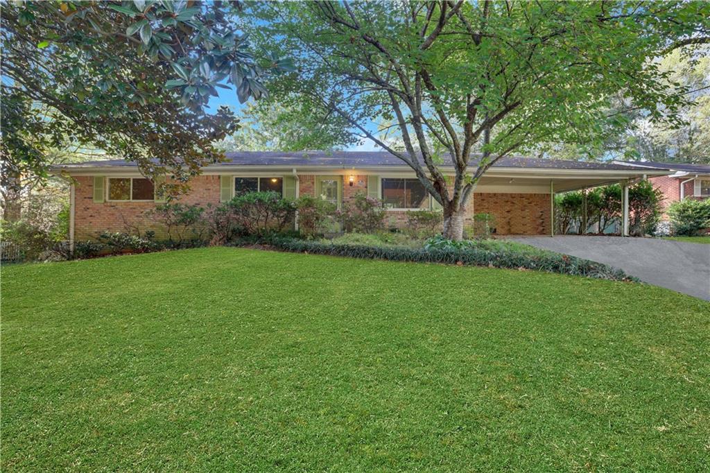 front view of a house with a yard