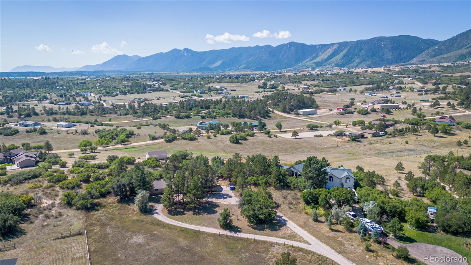 an aerial view of residential house and green space