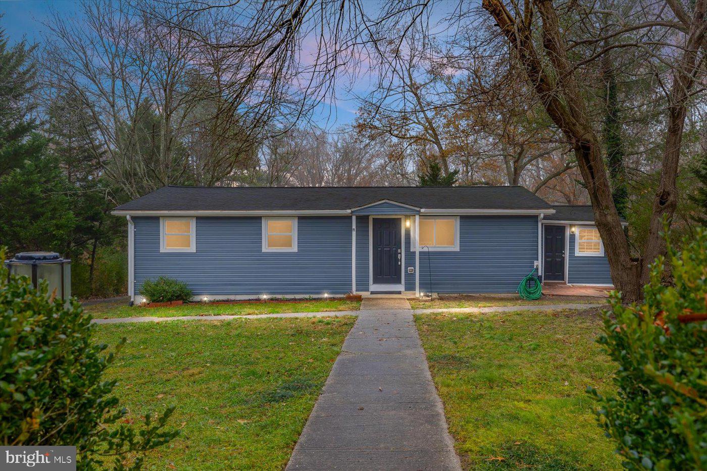 a front view of a house with yard