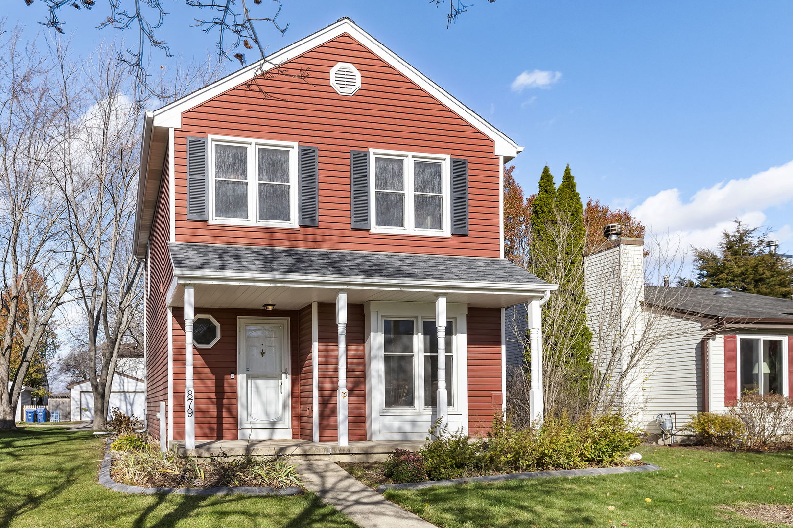 front view of a house with a yard