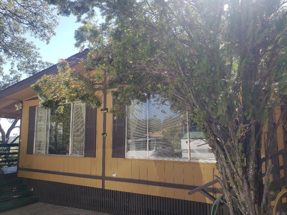 a view of a house with a tree