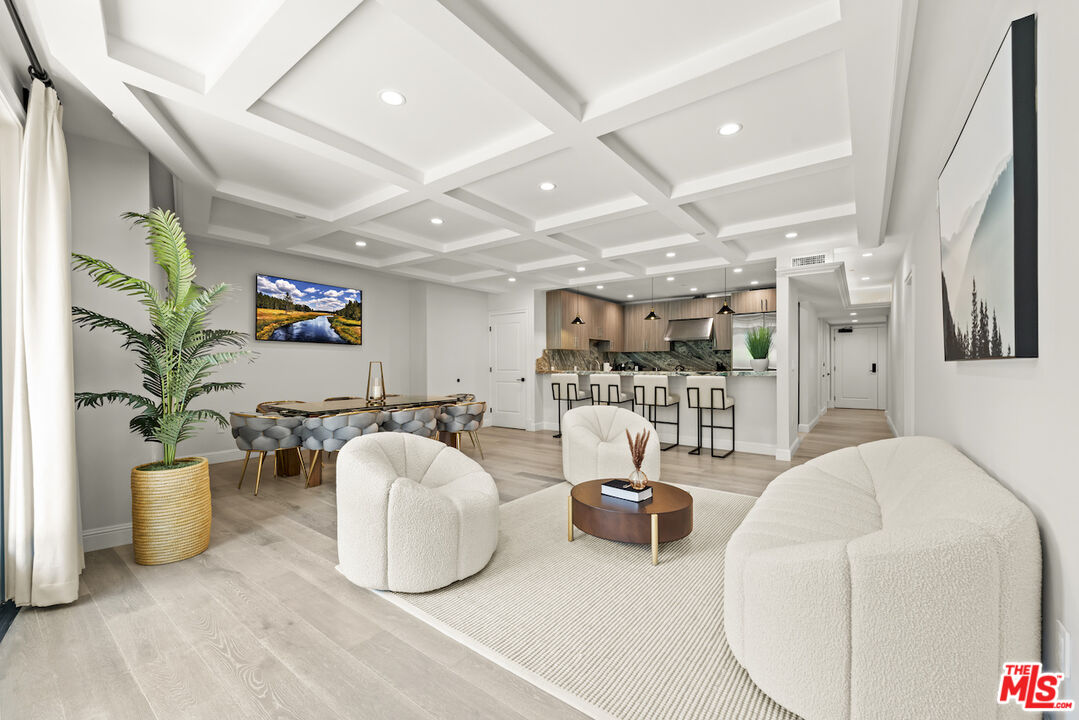 a living room with furniture and white walls