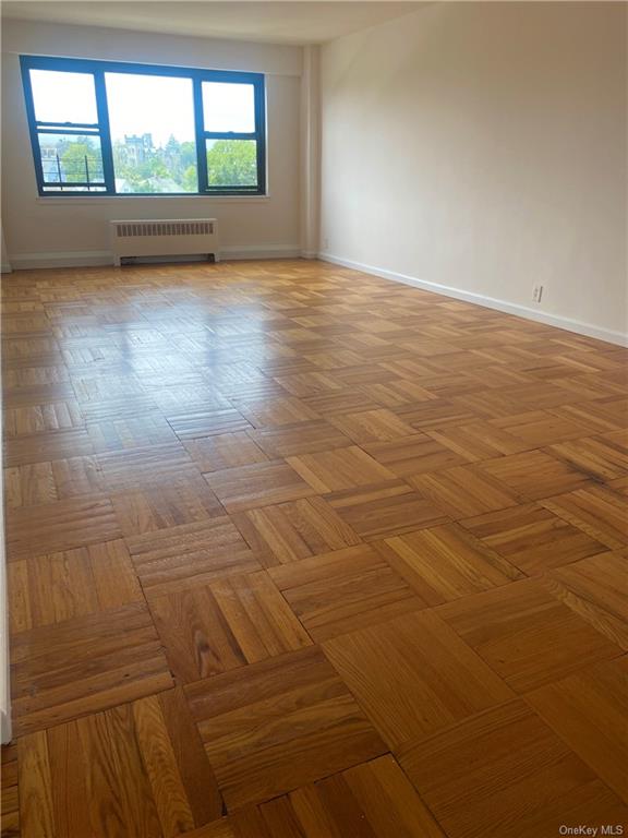 Living room featuring parquet flooring