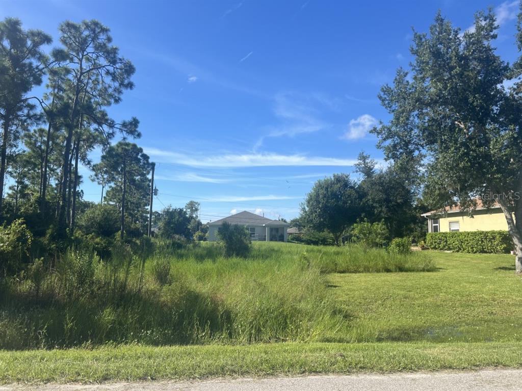 a view of a lake with a yard