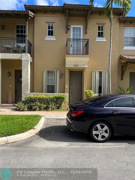 a car parked in front of a house