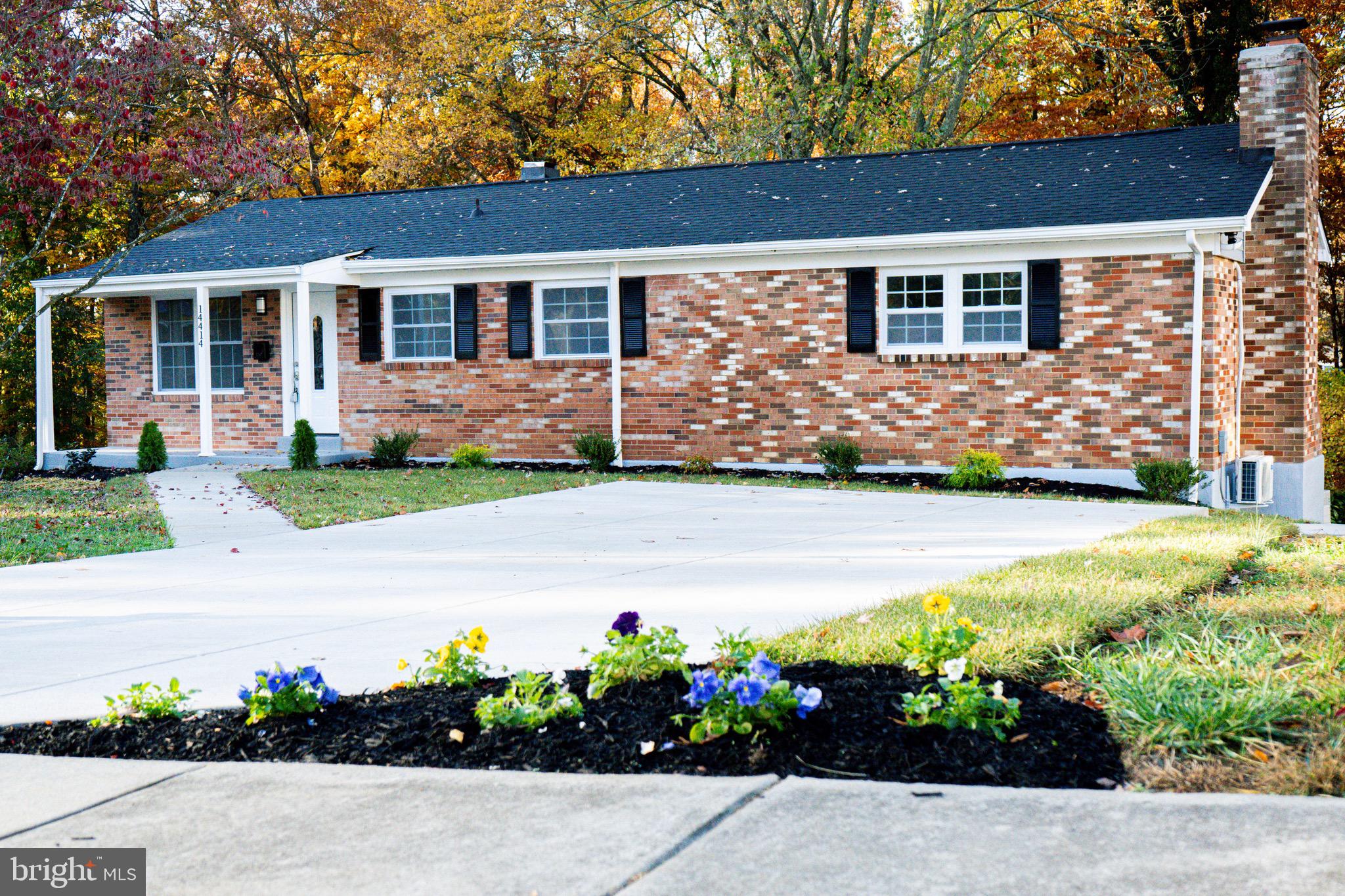 a front view of house with a yard