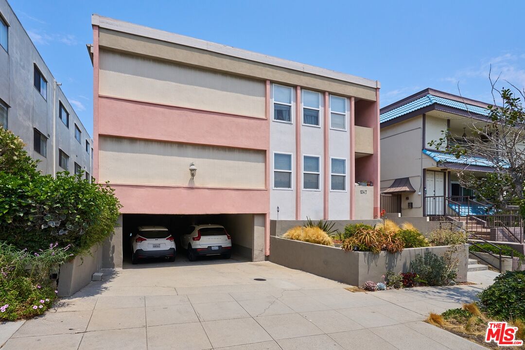 a front view of a building with outdoor seating