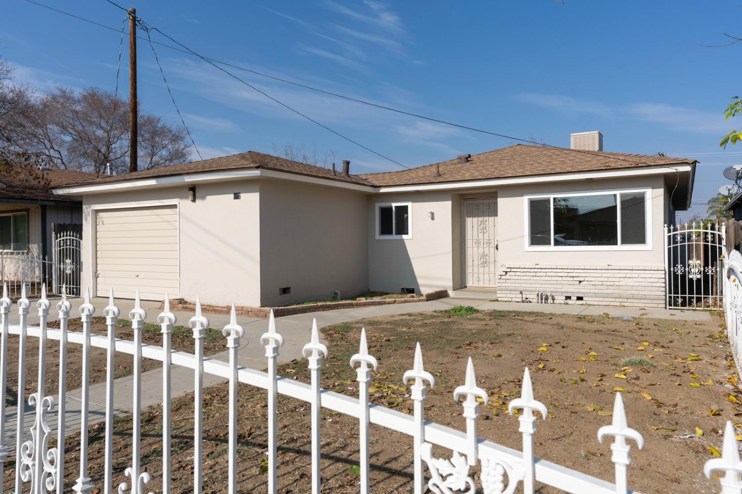 a front view of a house with a garage