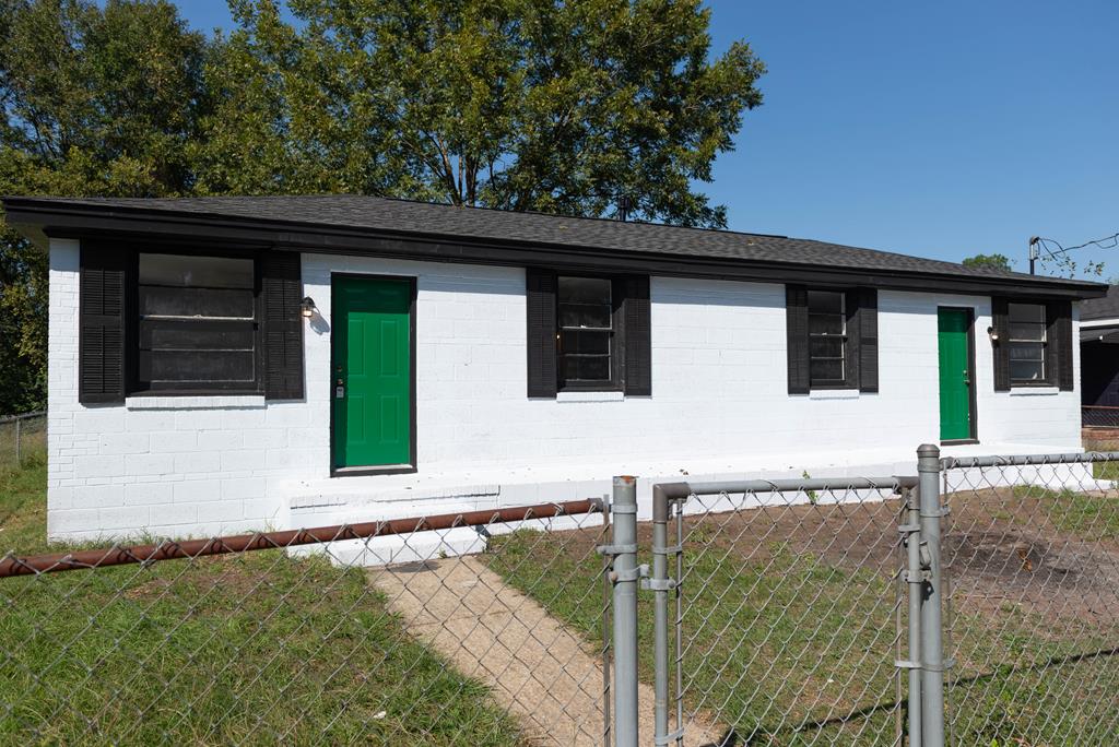 a house with trees in the background