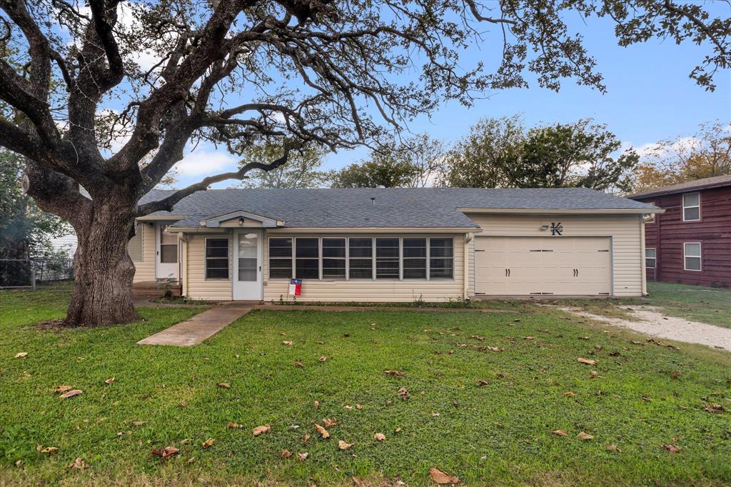 front view of a house with a yard