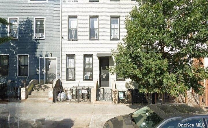 a view of a house with a tree