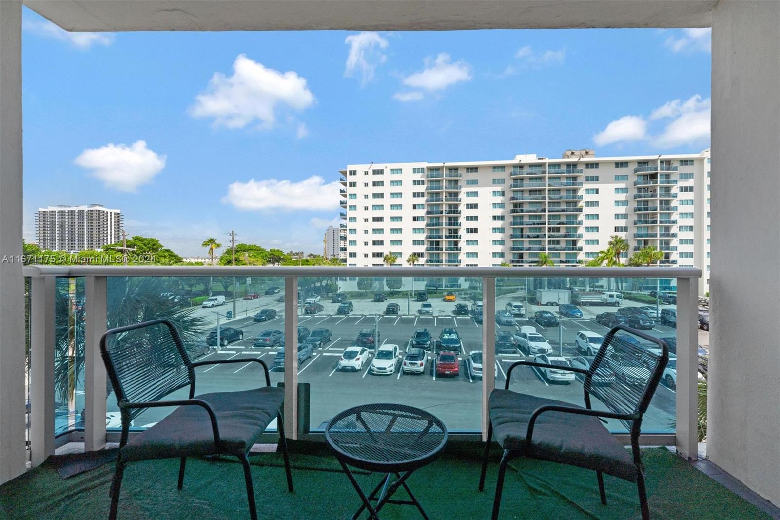 a view of a chairs and table in patio