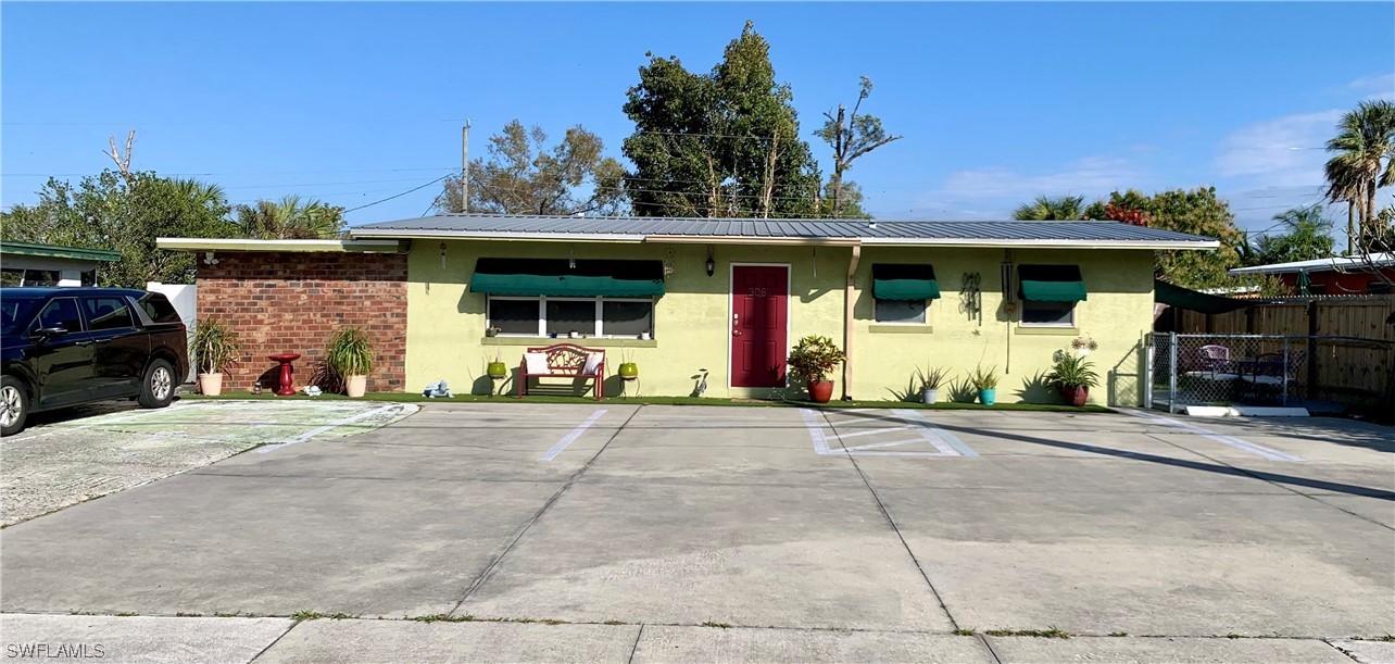 a front view of a house with basket ball court