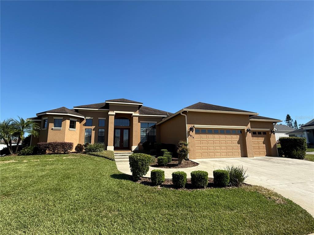 a front view of a house with a yard