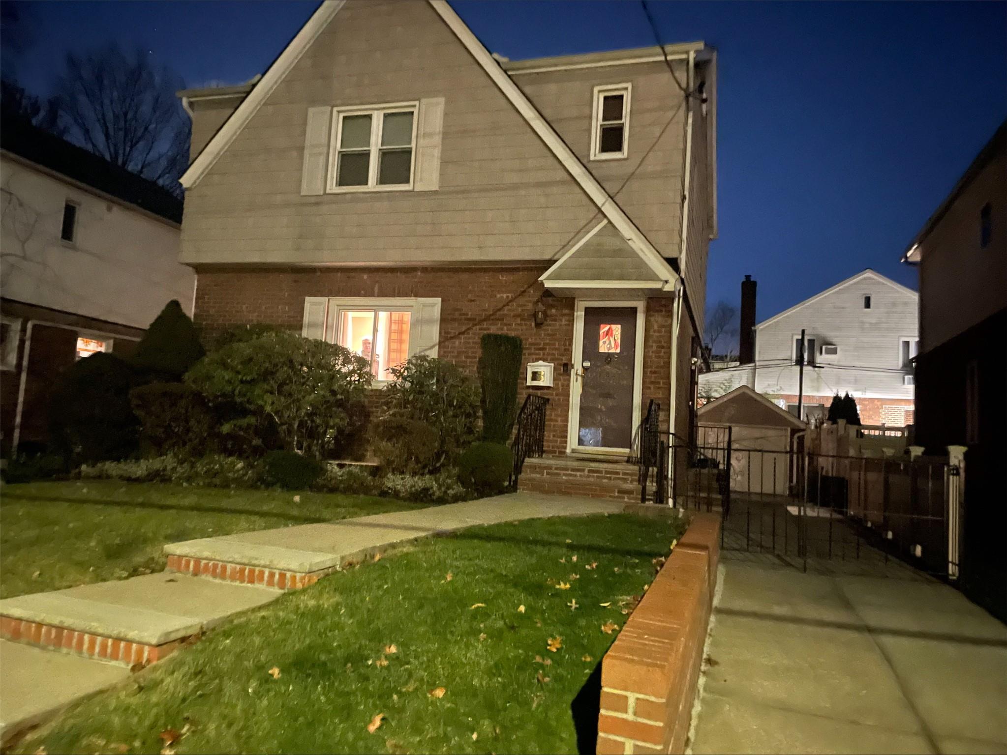 View of front of home featuring a lawn