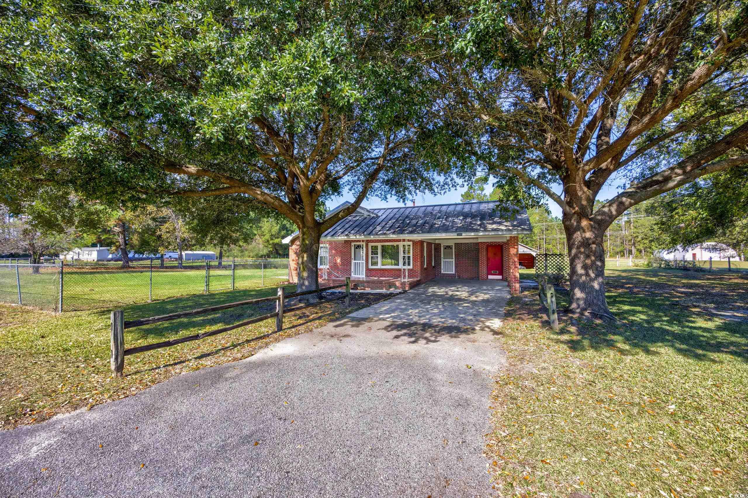 Single story home featuring a front yard