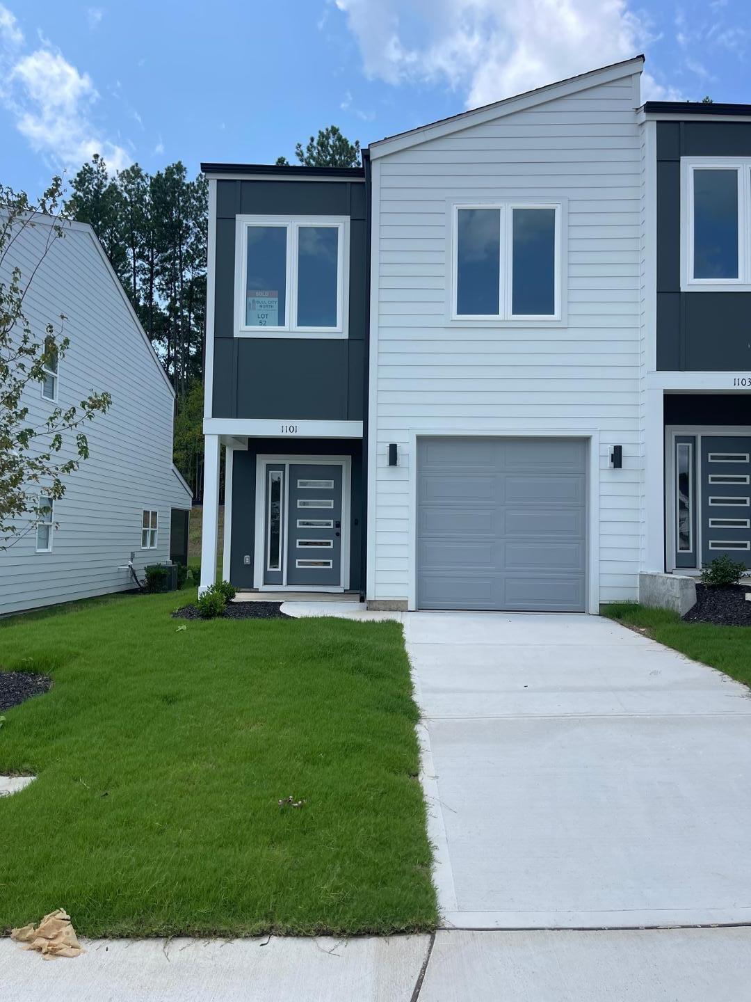 front view of a house with a yard