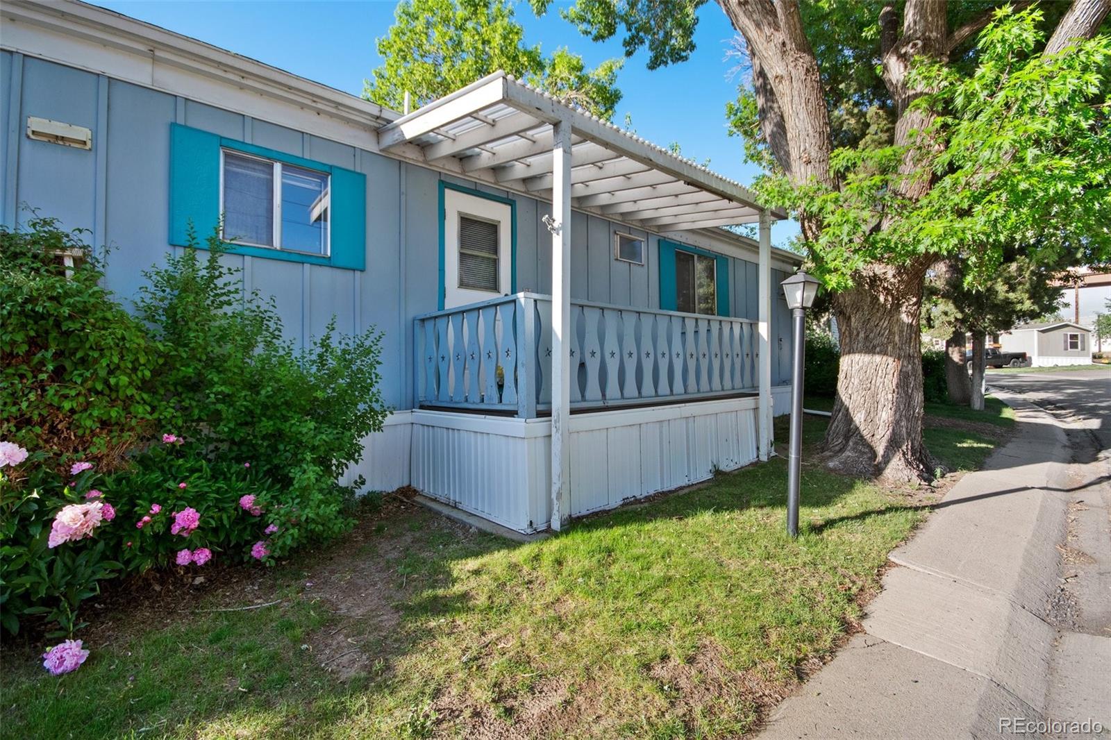 a view of a house with a backyard and garden