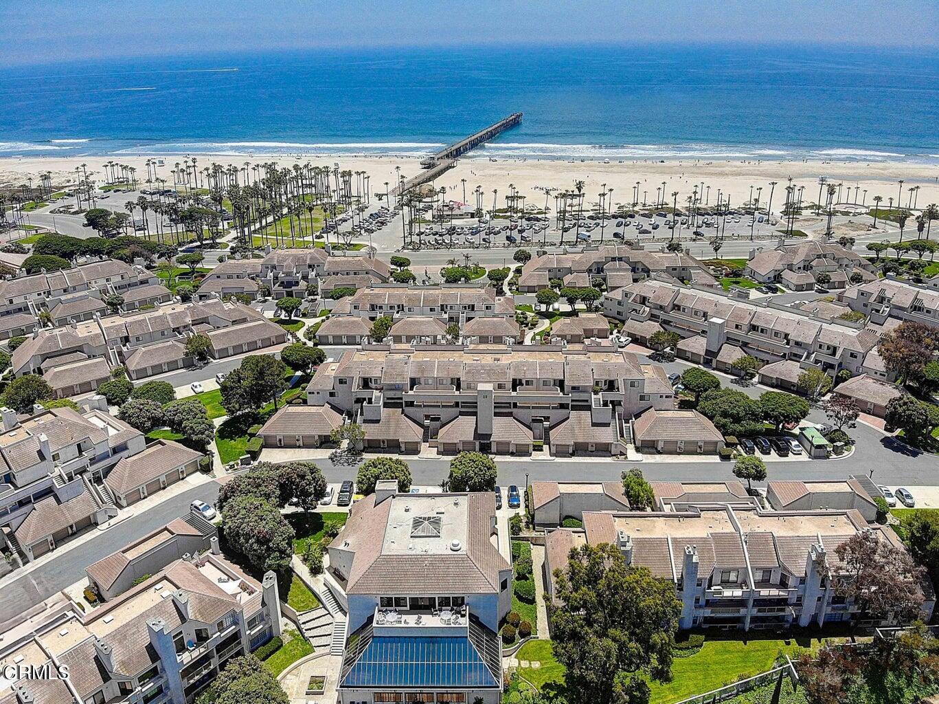 an aerial view of a city with ocean view