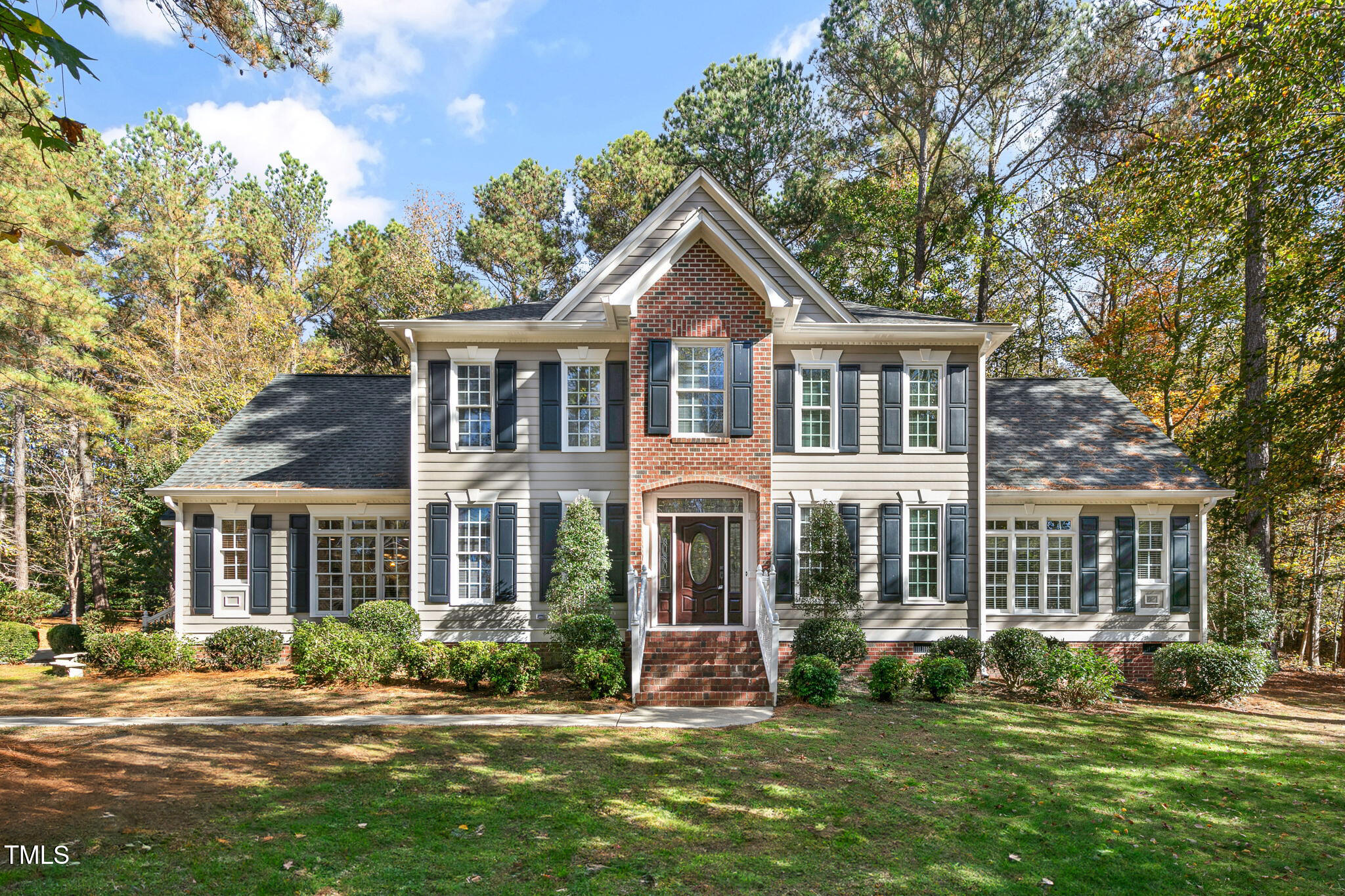 front view of a house with a yard