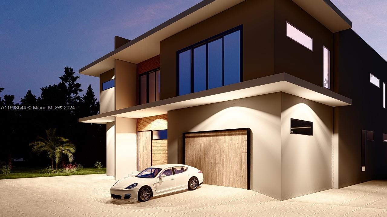 a view of a car park in front of a house