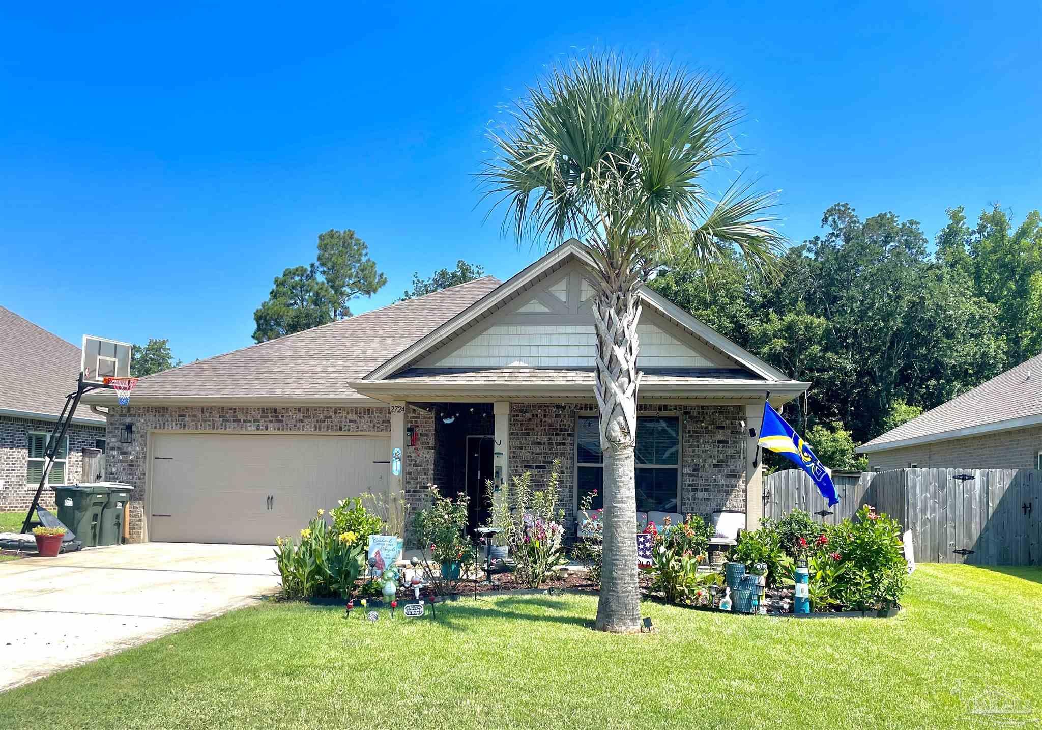 front view of a house with a yard