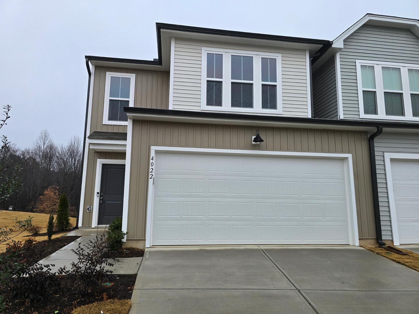 a front view of a house with garage