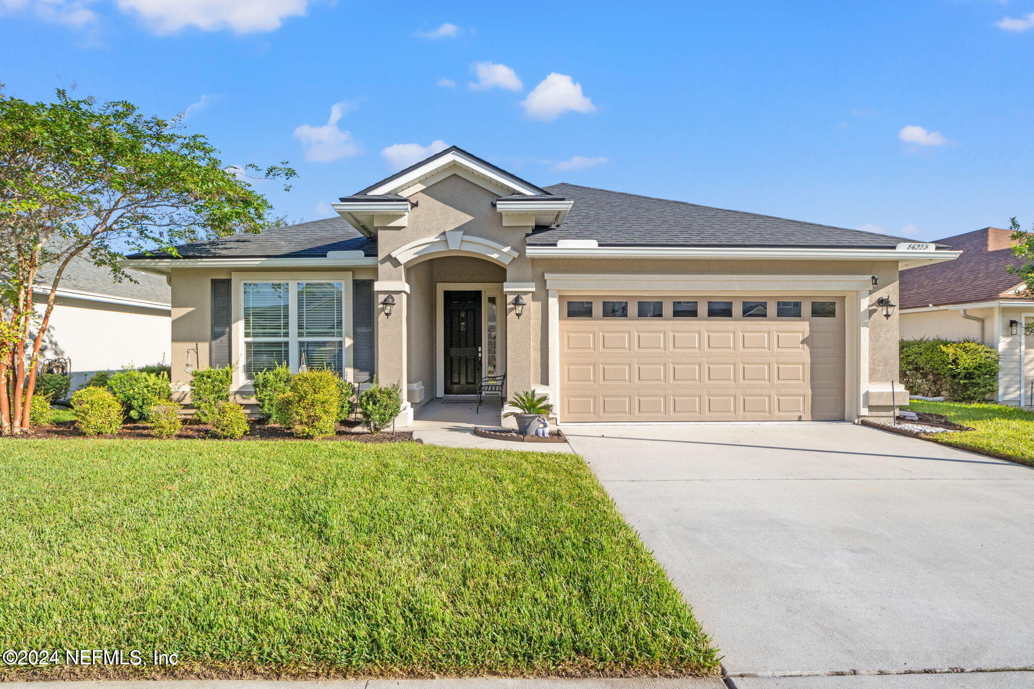 front view of a house with a yard