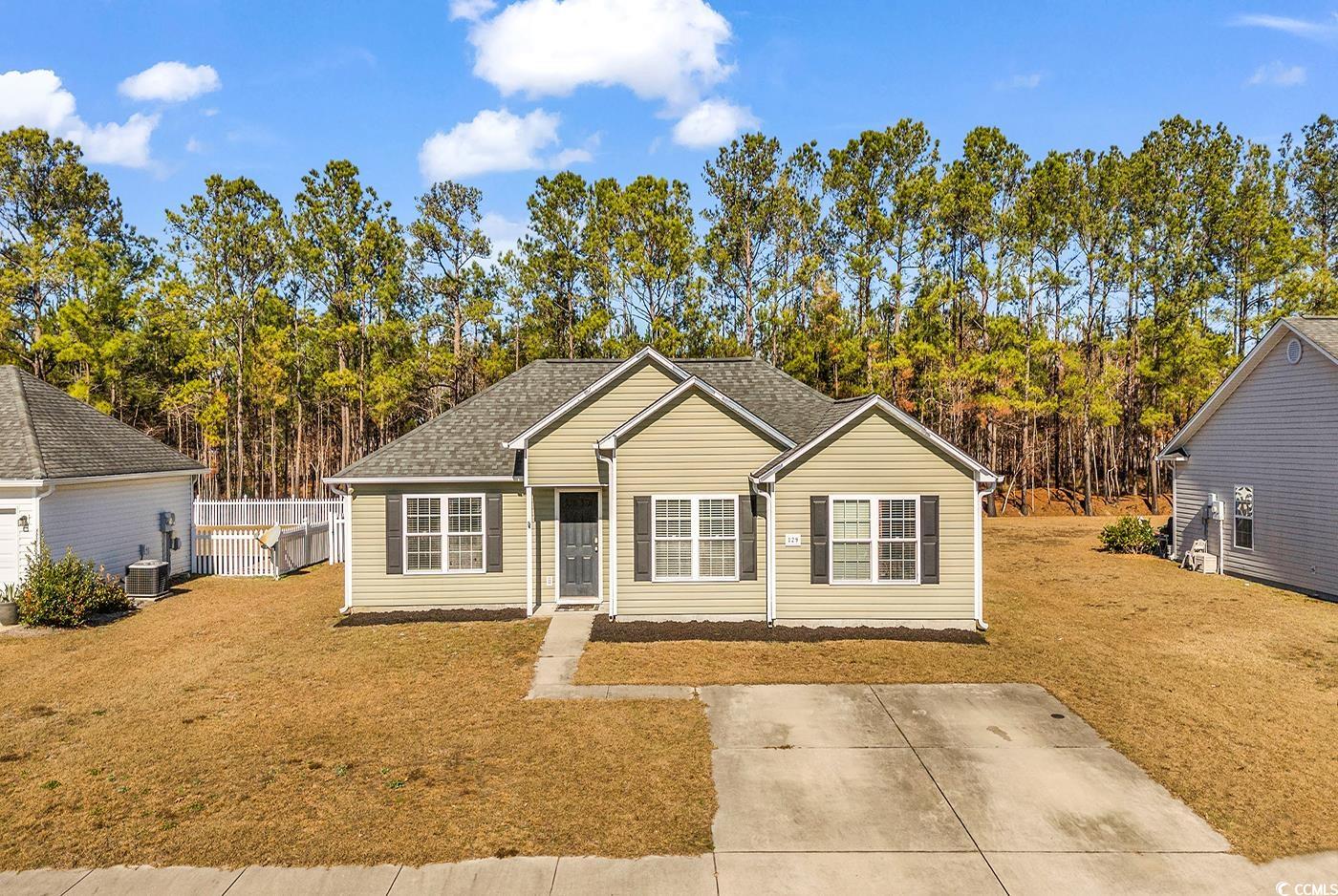 View of front of property featuring a front yard a