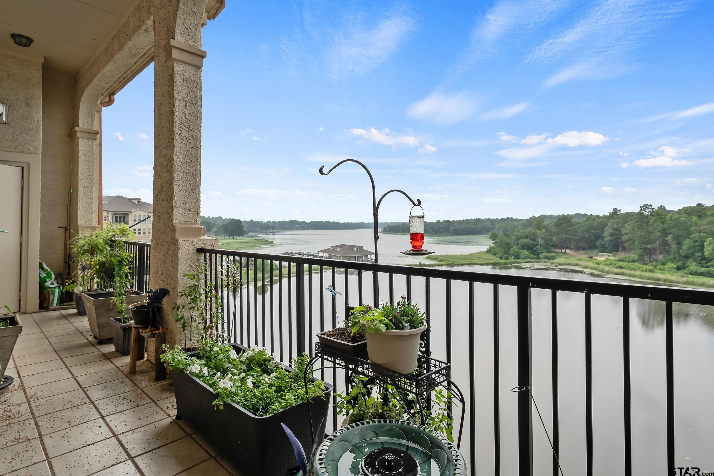 a view of a balcony with chairs