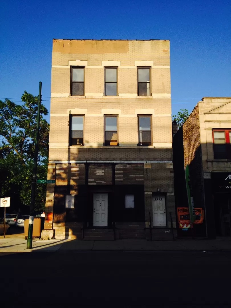 a view of a building with many windows and a table