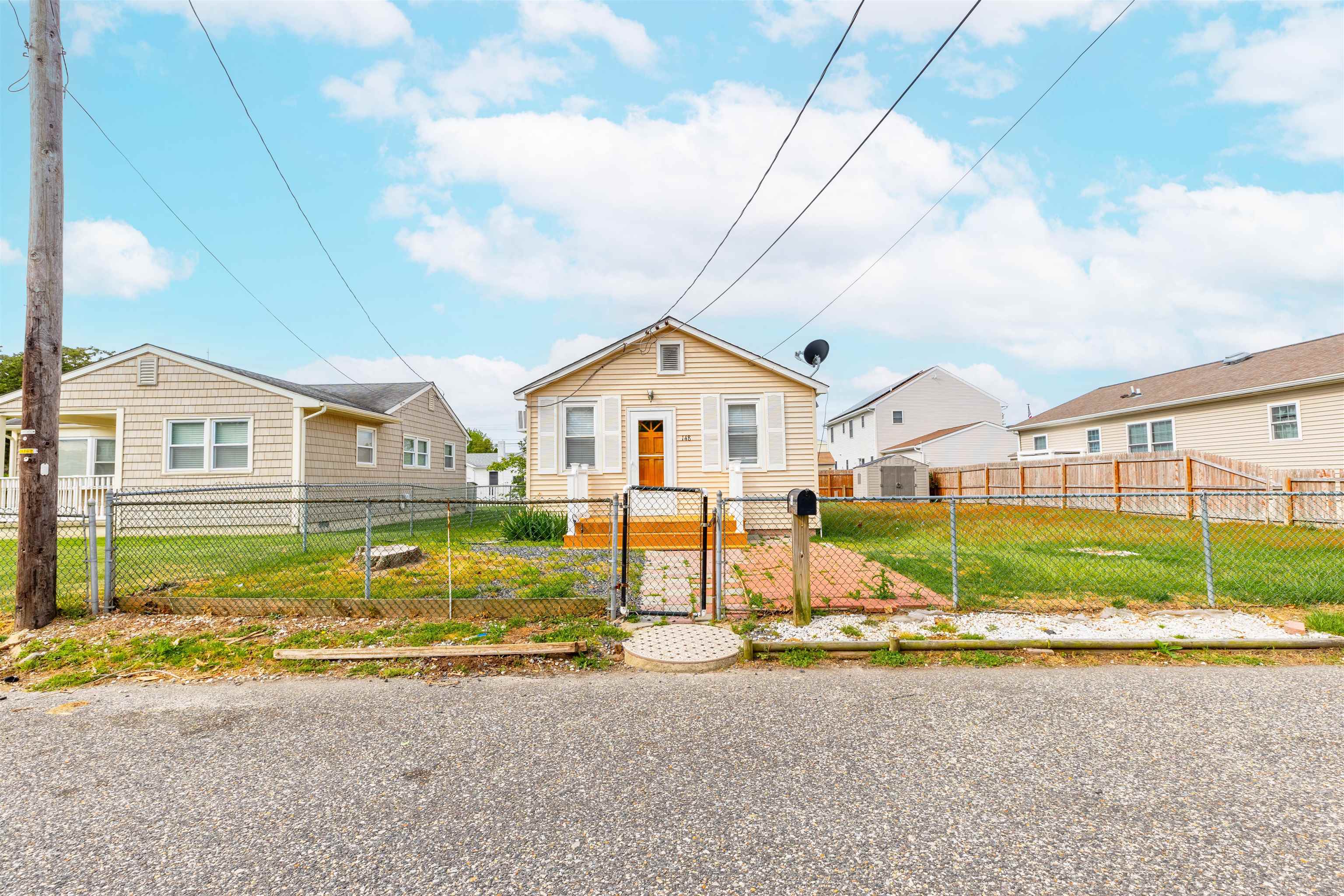 a view of a house next to a big yard