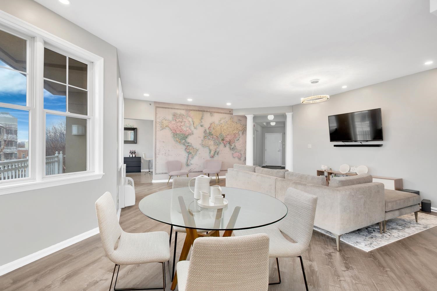 a dining room with furniture and a flat screen tv