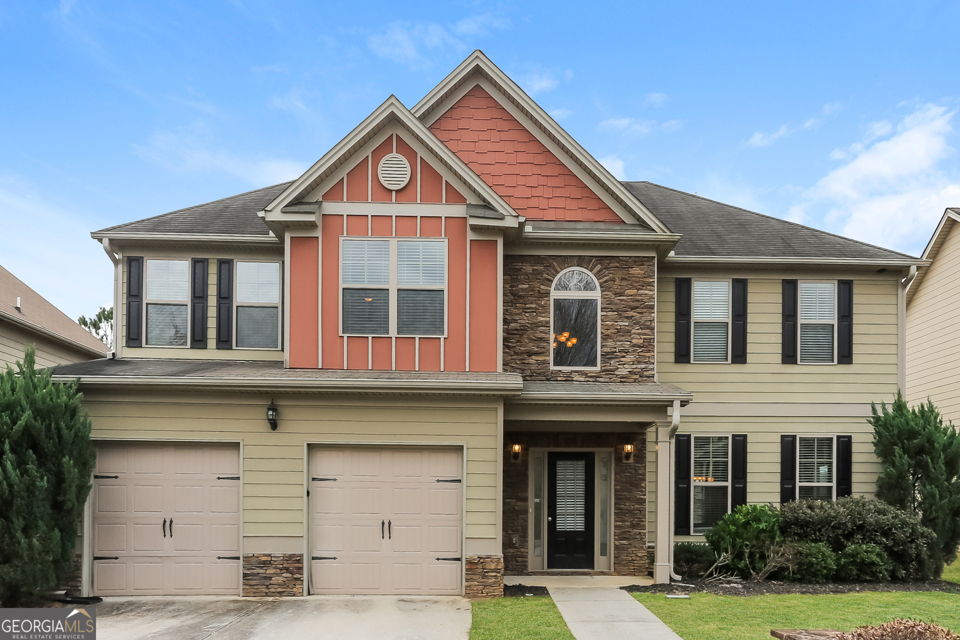 a front view of a house with a yard