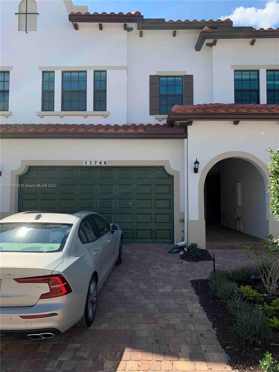 a front view of a house with parking