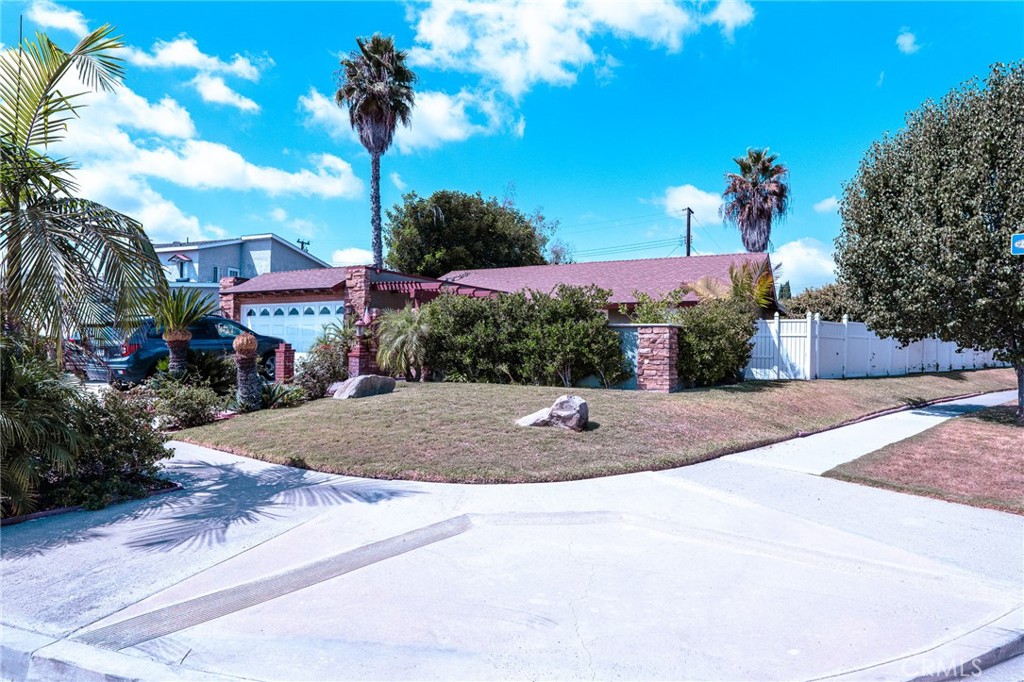 a view of a house with basketball court