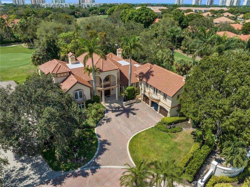 an aerial view of a house with garden space and street view