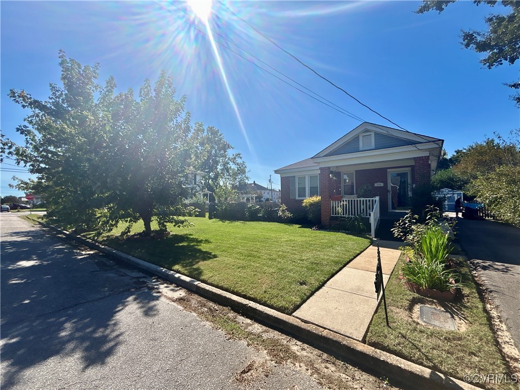 View of front of property featuring a front yard a