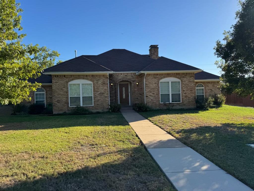 a front view of house with yard