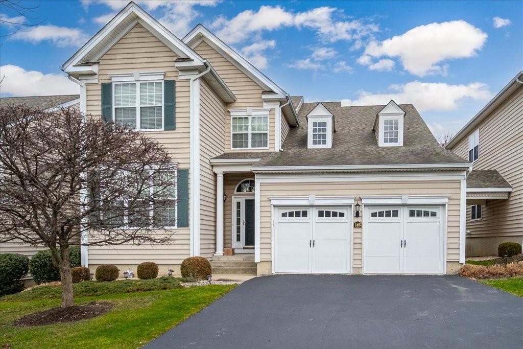 View of front of property featuring a garage