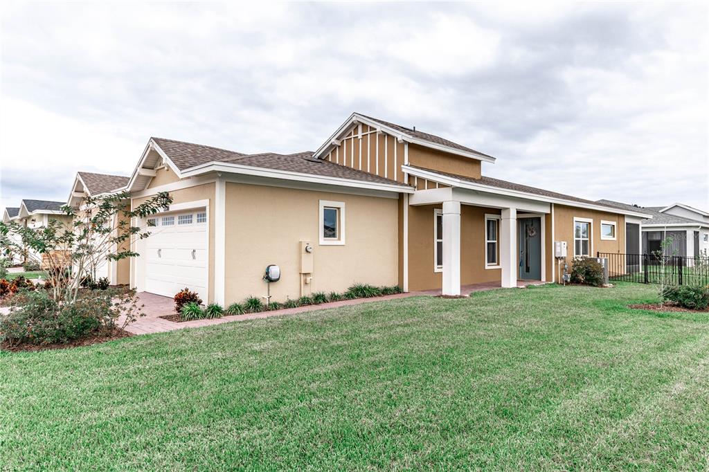 a front view of house with yard and green space