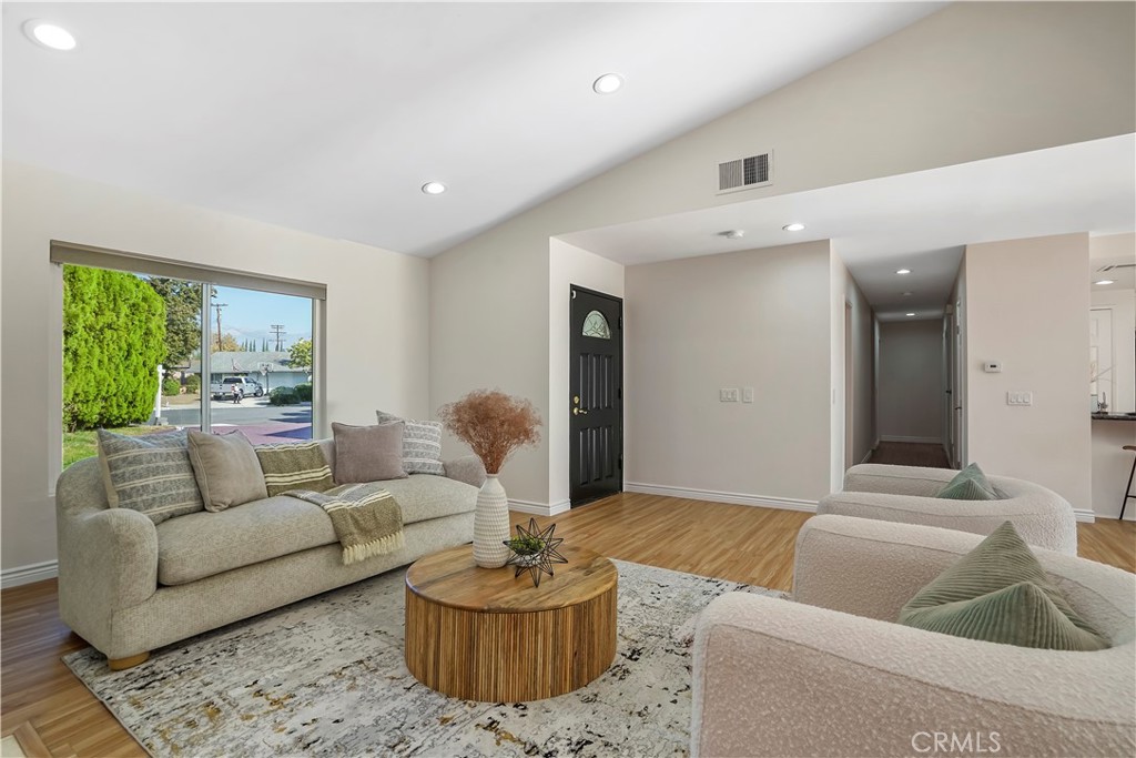 a living room with furniture and a large window