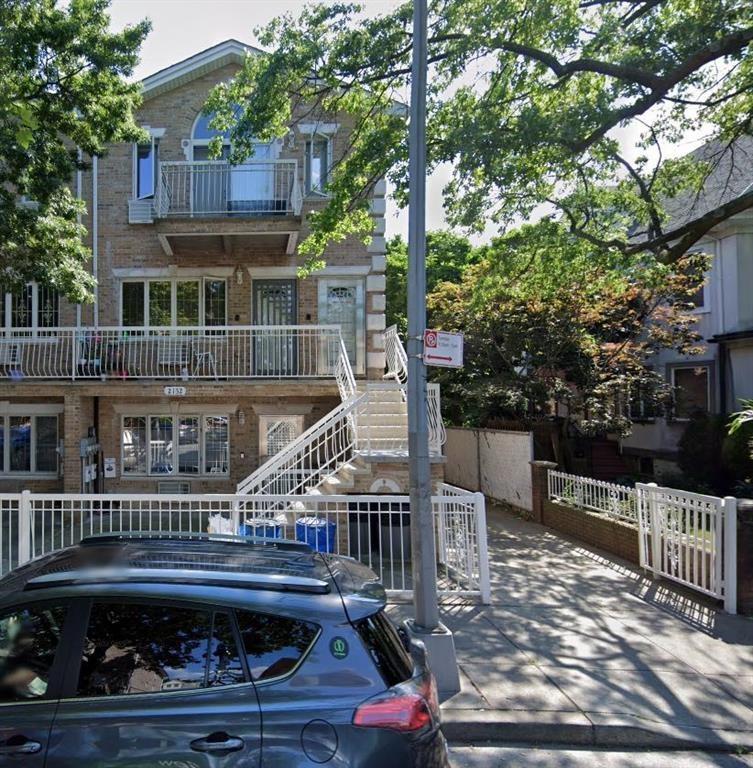 a front view of a house with a small yard