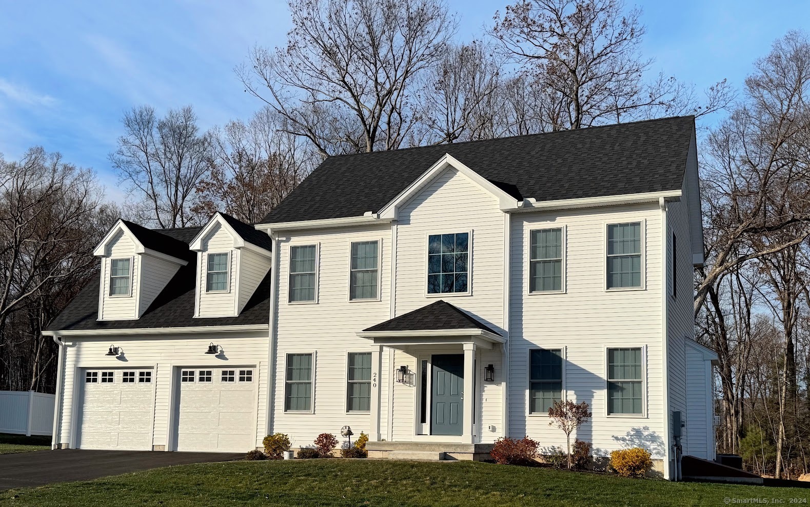 a front view of a house with a yard