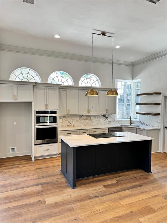 Fully renovated large kitchen with all new appliances, new cabinets, lighting, beautiful Calacatta Gold 3CM Quartz countertops and designer tile backsplash