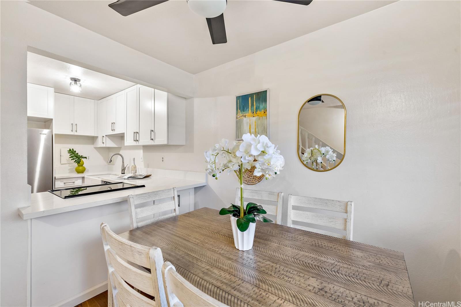 a kitchen with a table and chairs in it